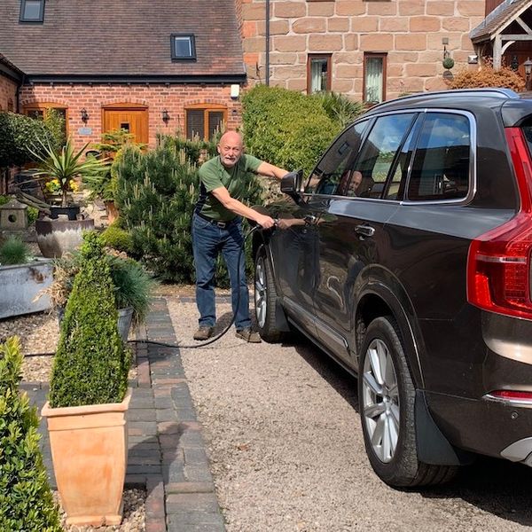 Ken Gibson plugging in his Volvo XC90 hybrid